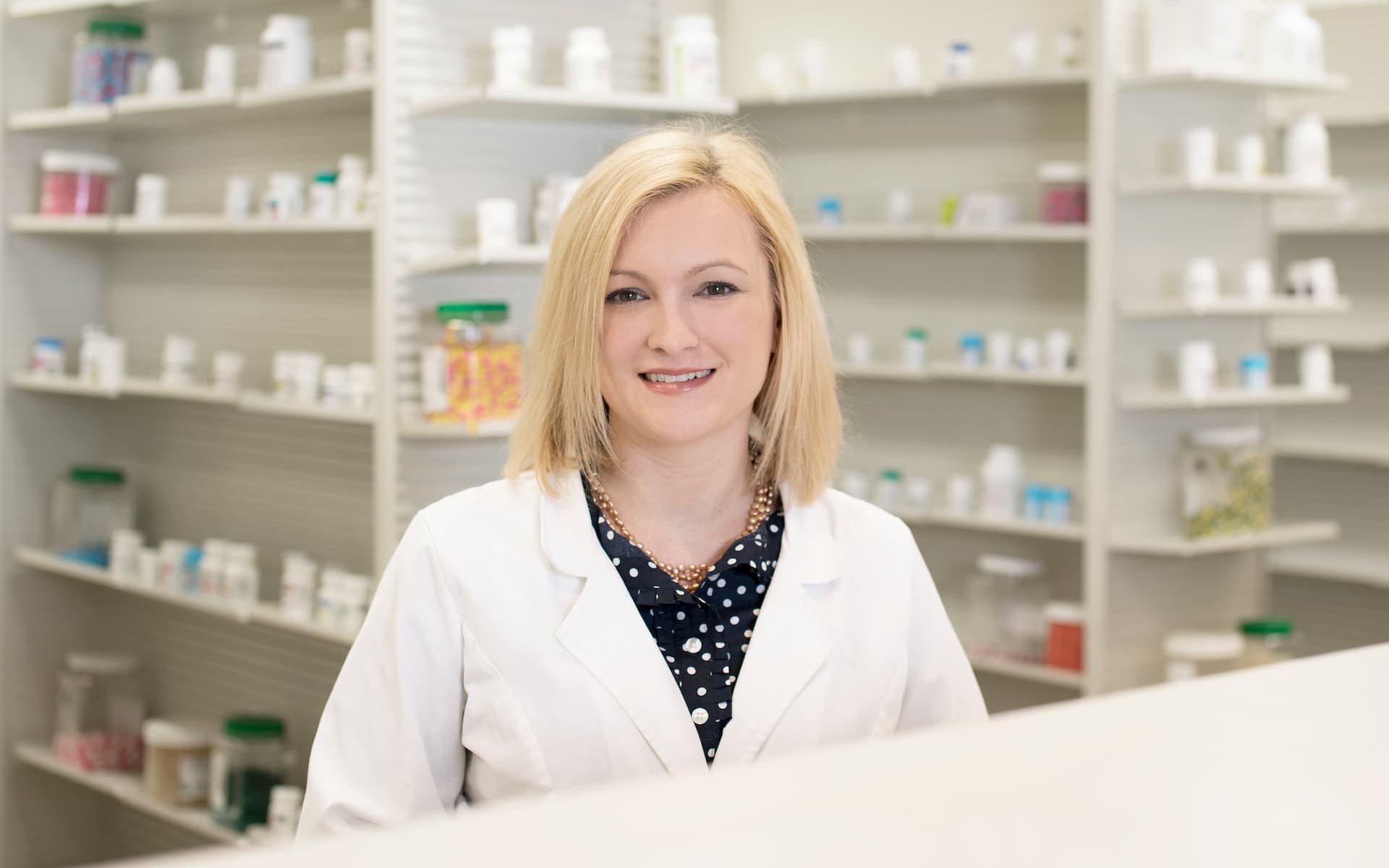 A headshot of Leah B. Argie inside the pharmacy